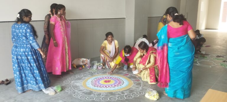 students drawing rangoli