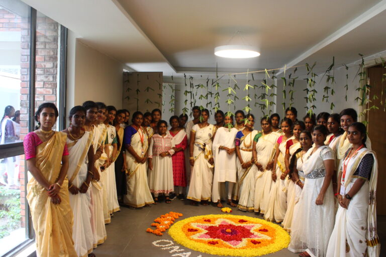 students in onam saree