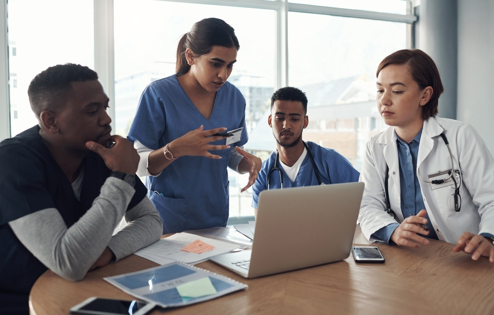 A group of students discussing about a medical data